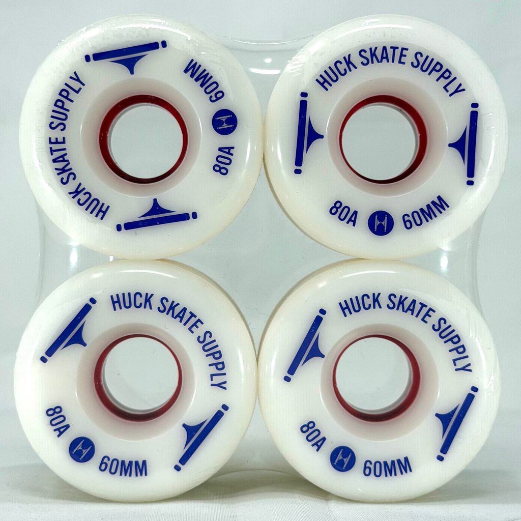Four white skateboard wheels with purple text on a white background