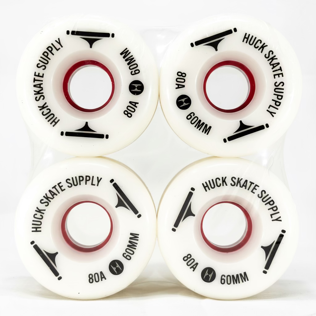 Four white skateboard wheels with black text on a white background