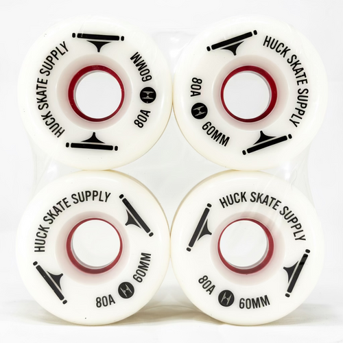Four white skateboard wheels with black text on a white background